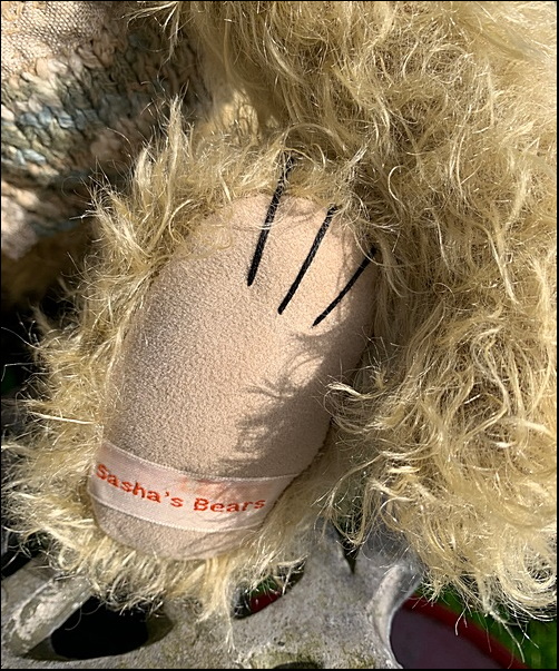 Charles' paw with Sasha's Bears label