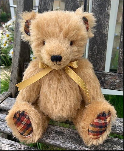 Clive sitting on a park bench