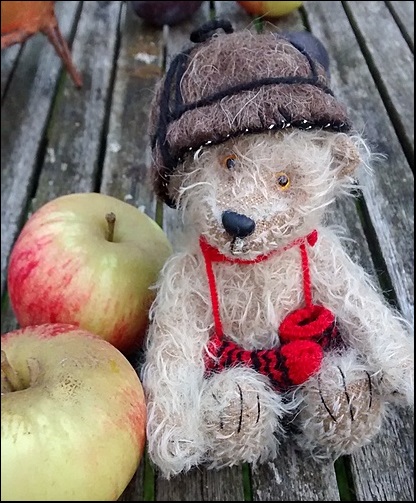 Jeremy on the garden table with apples